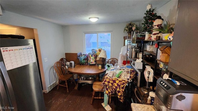 dining area featuring dark hardwood / wood-style floors