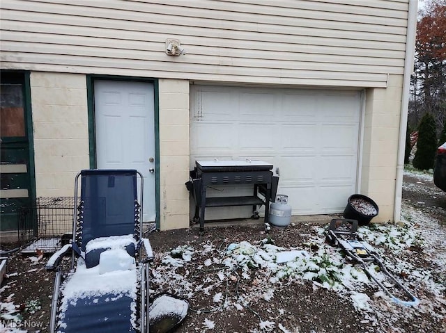 view of snow covered garage