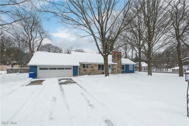 ranch-style house featuring a garage