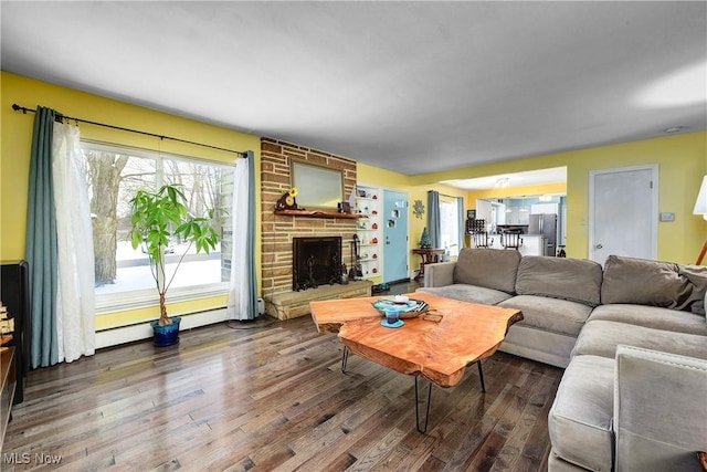 living room featuring a fireplace and hardwood / wood-style floors