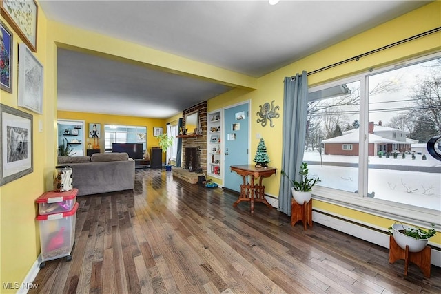 living room featuring a fireplace and wood-type flooring