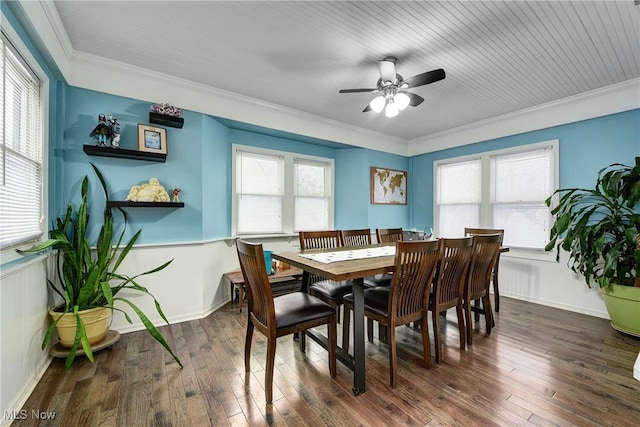 dining room with ceiling fan, dark hardwood / wood-style flooring, plenty of natural light, and ornamental molding