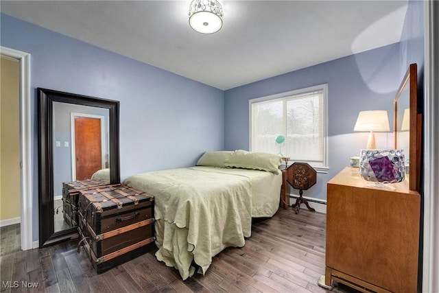 bedroom featuring dark hardwood / wood-style floors and a baseboard radiator