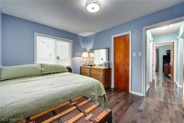 bedroom featuring dark hardwood / wood-style flooring