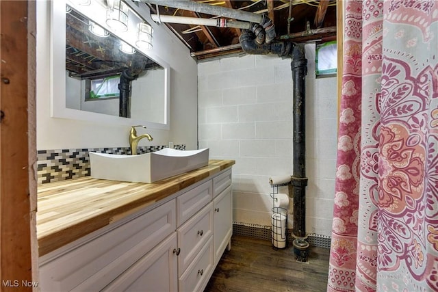 bathroom with hardwood / wood-style flooring and vanity