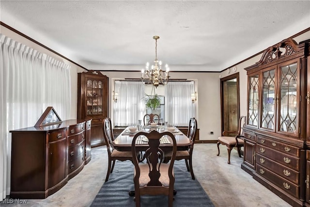 dining space with a chandelier and light colored carpet