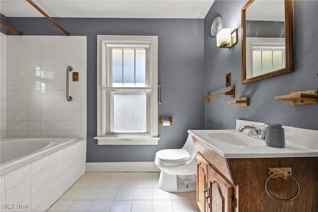 full bathroom featuring tile patterned flooring, tiled shower / bath combo, toilet, and vanity