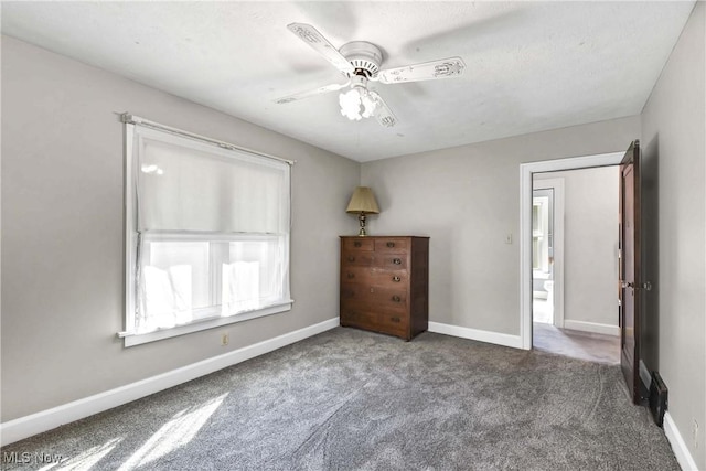 unfurnished bedroom featuring carpet flooring and ceiling fan