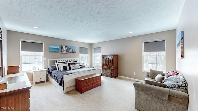 carpeted bedroom featuring a textured ceiling