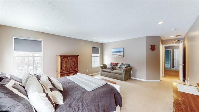 bedroom featuring light carpet