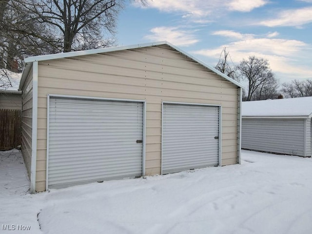 view of snow covered garage