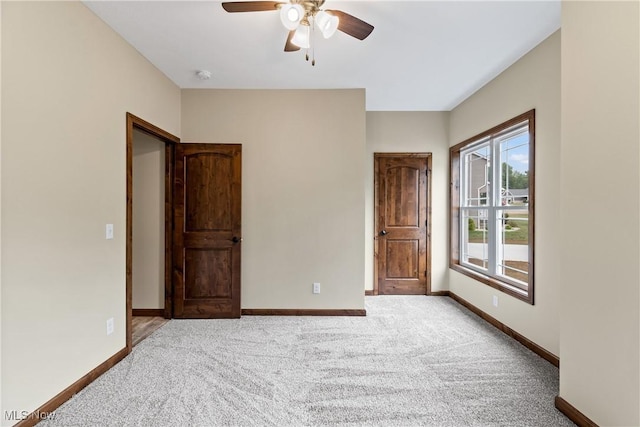 unfurnished bedroom featuring carpet flooring and ceiling fan