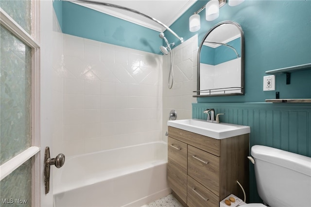 full bathroom featuring crown molding, toilet, vanity, and washtub / shower combination