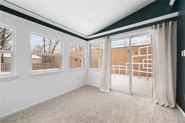 unfurnished sunroom with a healthy amount of sunlight and lofted ceiling