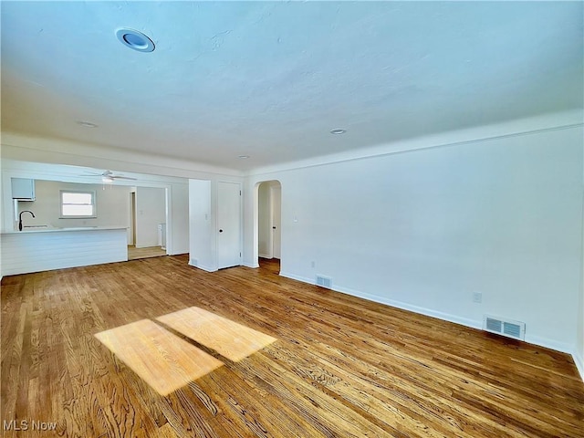 unfurnished living room with hardwood / wood-style floors