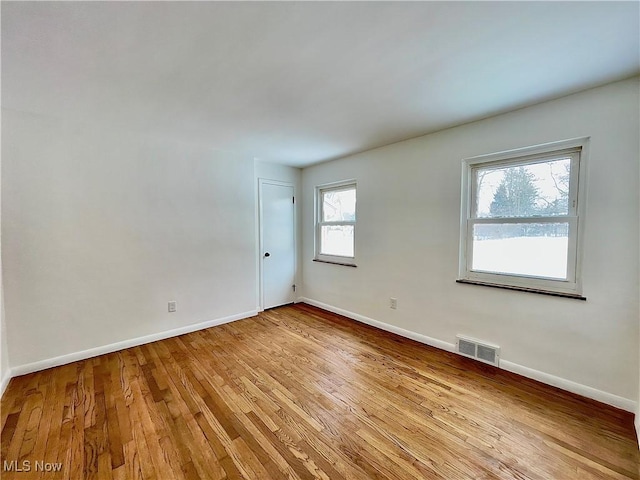 unfurnished room with light hardwood / wood-style flooring