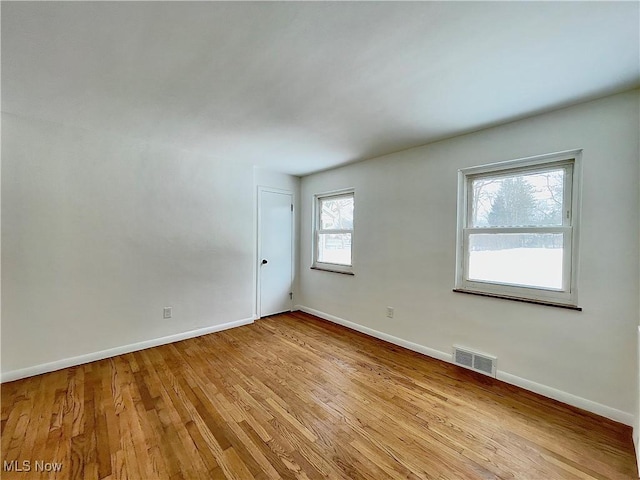 unfurnished room featuring light wood-type flooring