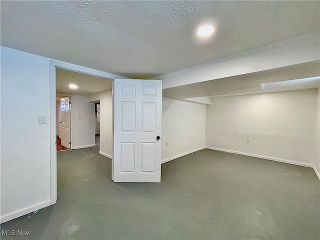 basement with a textured ceiling