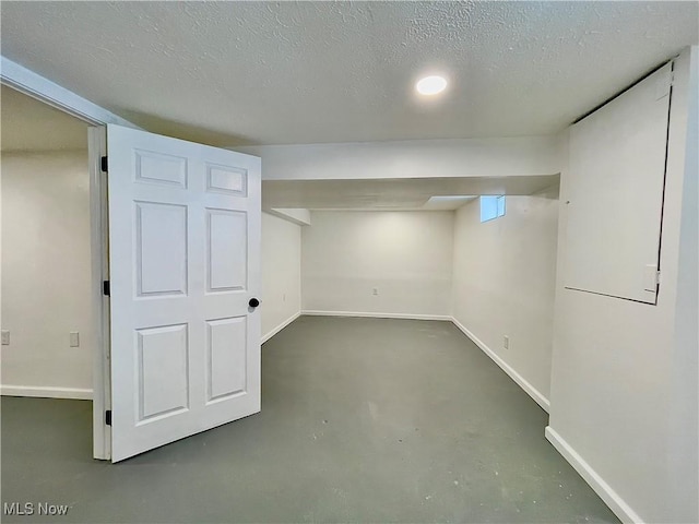 basement with a textured ceiling