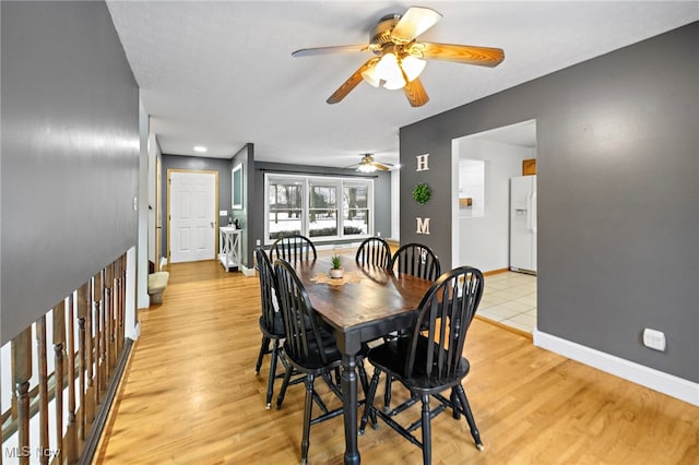 dining room featuring ceiling fan and light hardwood / wood-style floors