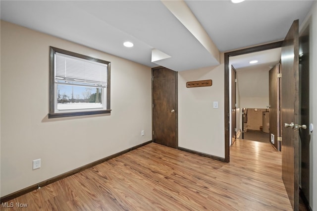 unfurnished room with light hardwood / wood-style floors