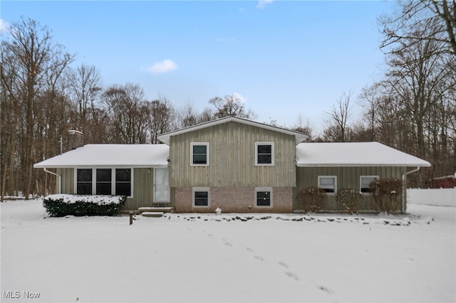 view of snow covered house