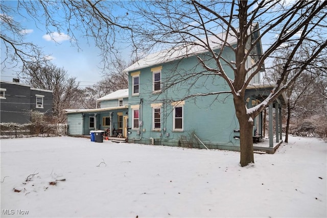 view of snow covered house