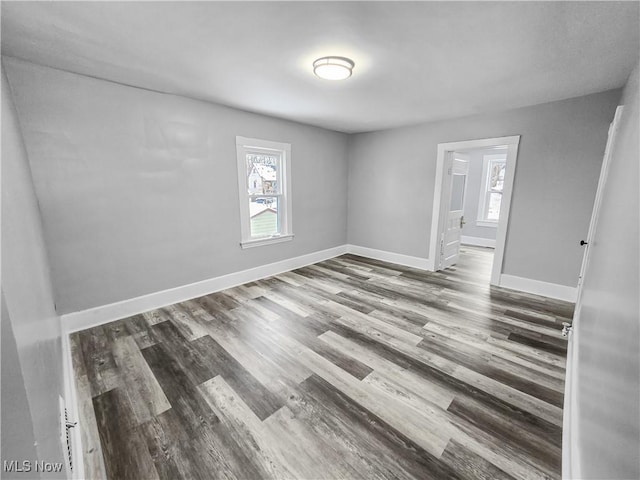 spare room with hardwood / wood-style flooring