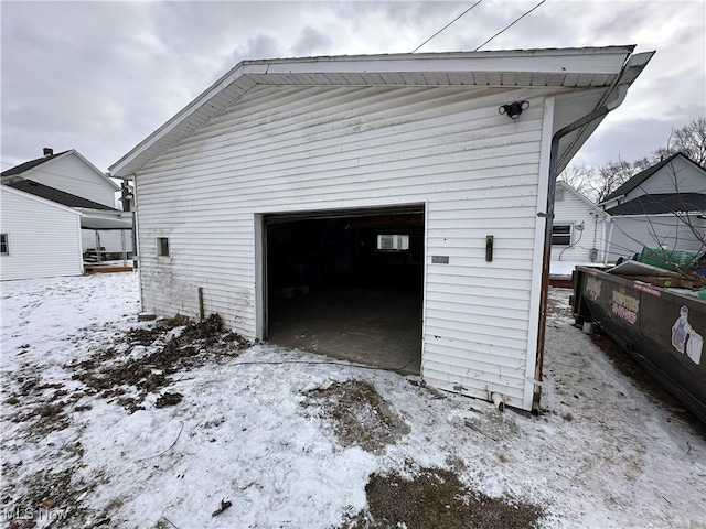 view of snow covered garage