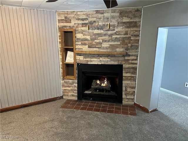 interior details with carpet flooring, a fireplace, and wooden walls