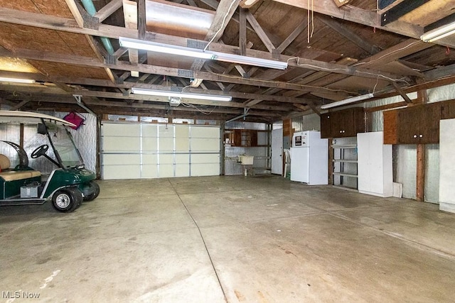 garage featuring white refrigerator