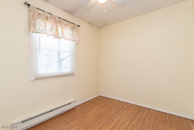 unfurnished room featuring baseboard heating, ceiling fan, and hardwood / wood-style flooring