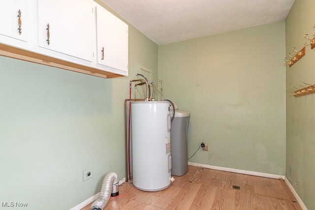 utility room with electric water heater