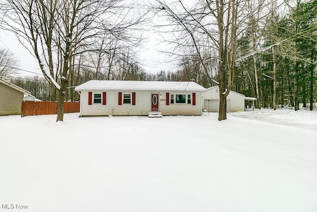 ranch-style home featuring an outbuilding