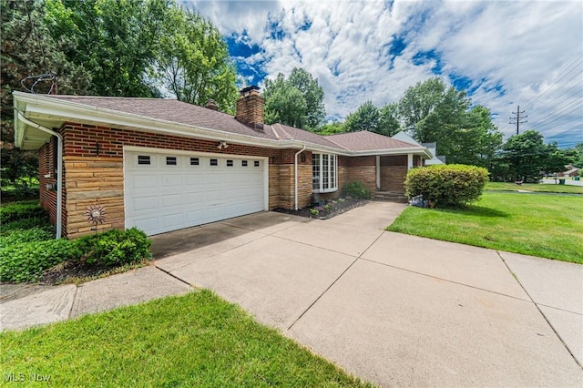 ranch-style home featuring a front lawn and a garage