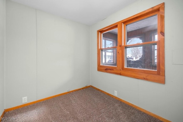 empty room featuring carpet flooring