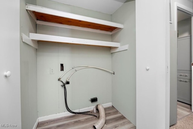 laundry room with hookup for a washing machine and light hardwood / wood-style flooring