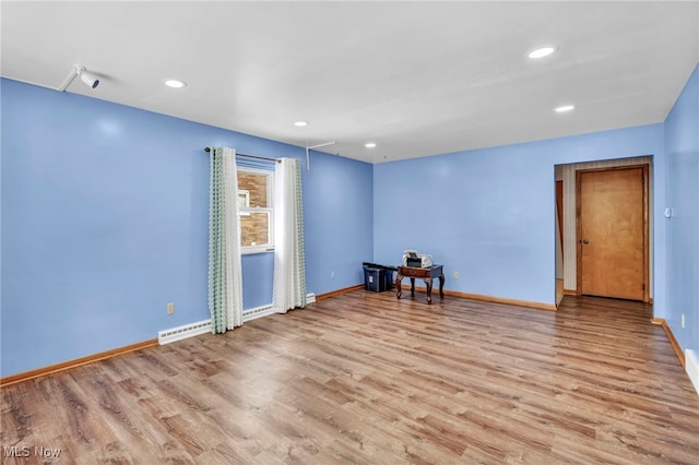 spare room with light hardwood / wood-style flooring