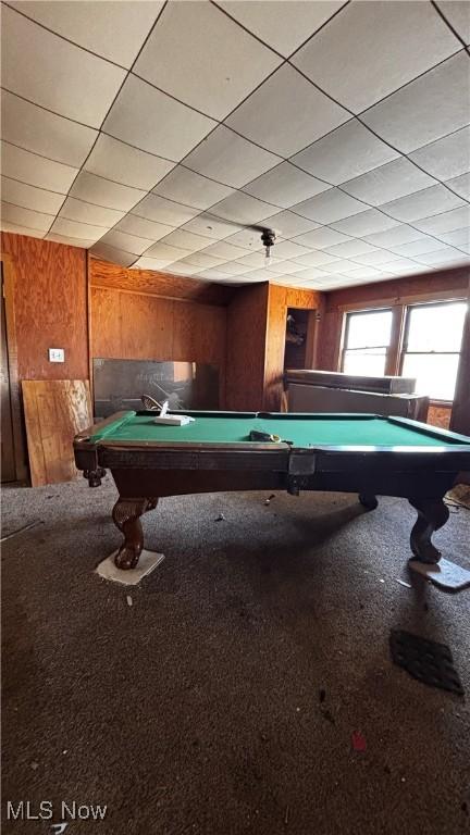 playroom featuring carpet flooring, wood walls, and pool table