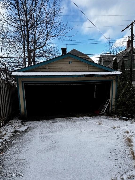 view of snow covered garage