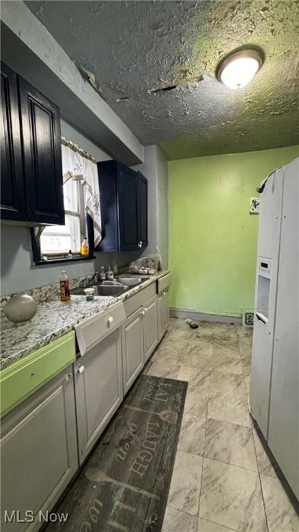 kitchen with light stone countertops