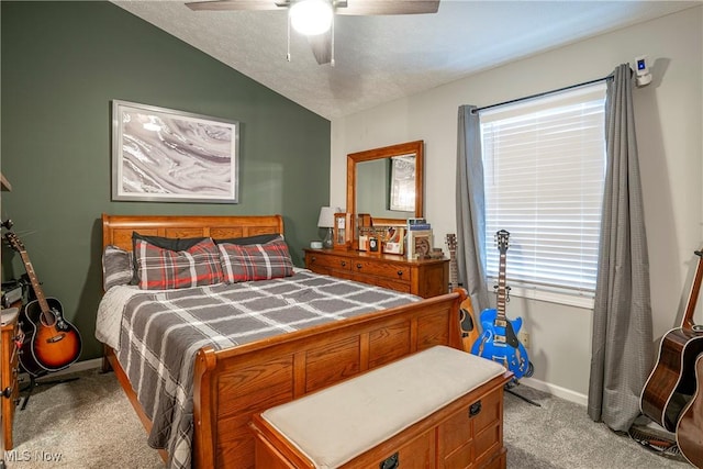 bedroom with light carpet, a textured ceiling, vaulted ceiling, and ceiling fan