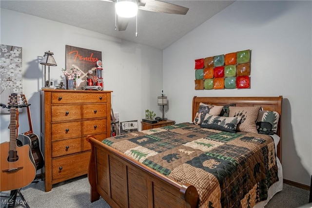 bedroom featuring a textured ceiling, ceiling fan, lofted ceiling, and light carpet