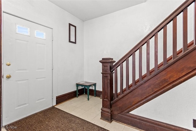 entrance foyer with light tile patterned floors