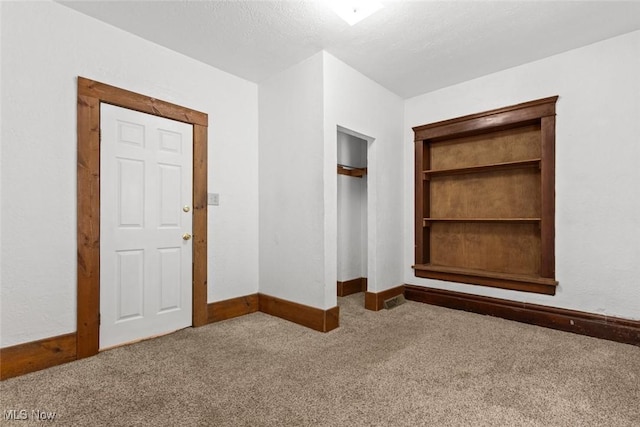 unfurnished bedroom with carpet