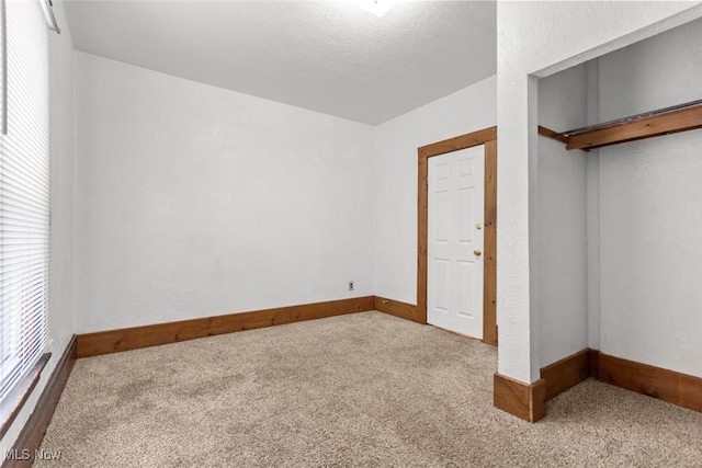 unfurnished bedroom with carpet flooring