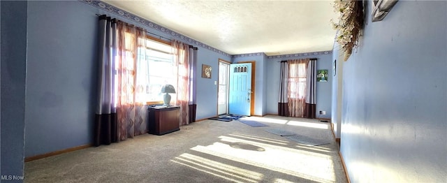 interior space with a healthy amount of sunlight and light colored carpet