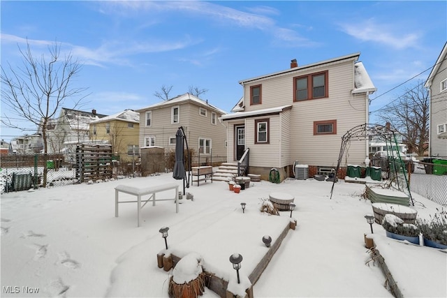 view of snow covered house