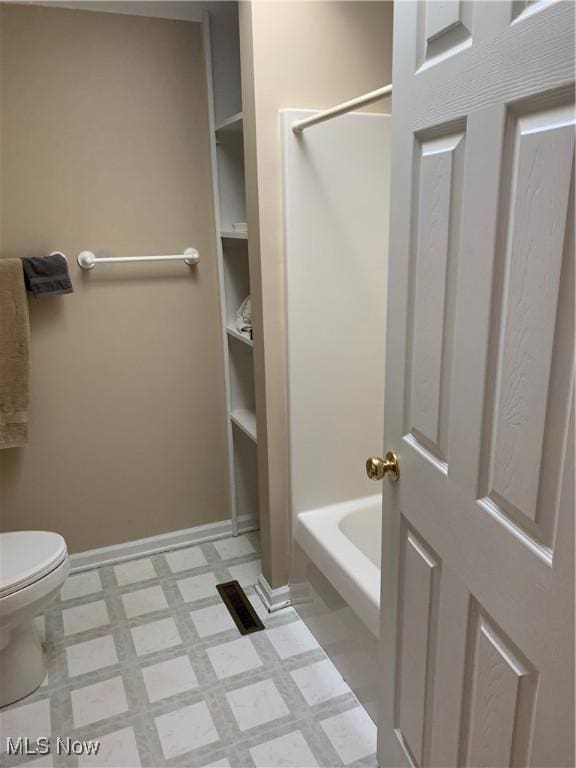 bathroom with built in features, separate shower and tub, and toilet