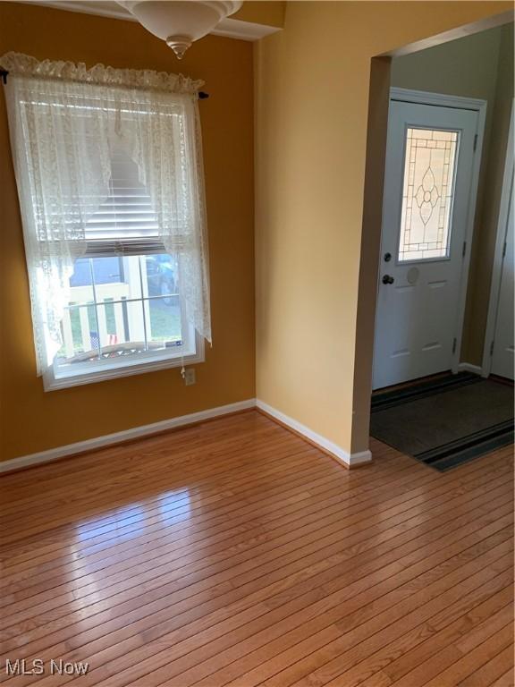 foyer entrance with light wood-type flooring